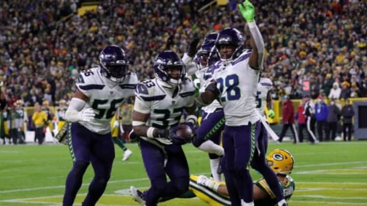 GREEN BAY, WISCONSIN – NOVEMBER 14: Jamal Adams #33 of the Seattle Seahawks celebrates with teammates after forcing an interception during the third quarter against the Green Bay Packers at Lambeau Field on November 14, 2021 in Green Bay, Wisconsin. (Photo by Stacy Revere/Getty Images)