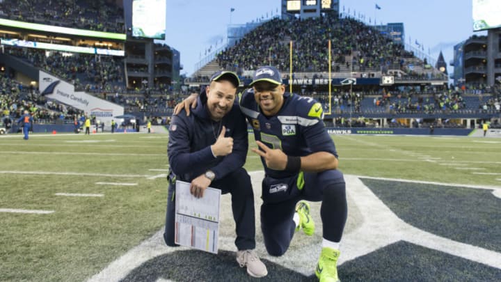 Dec 30, 2018; Seattle, WA, USA; Seattle Seahawks offensive coordinator Brian Schottenheimer and Seattle Seahawks quarterback Russell Wilson (3) pose for a photo after the game against the Arizona Cardinals at CenturyLink Field. Seattle defeated Arizona 27-24. Mandatory Credit: Steven Bisig-USA TODAY Sports