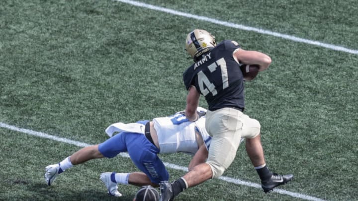 Sep 5, 2020; West Point, New York, USA; Middle Tennessee Blue Raiders quarterback Asher O'Hara (10) misses the tackle on Army Black Knights linebacker Jon Rhattigan (47) as he runs an interception in for a touchdown during the second half at Michie Stadium. Mandatory Credit: Vincent Carchietta-USA TODAY Sports