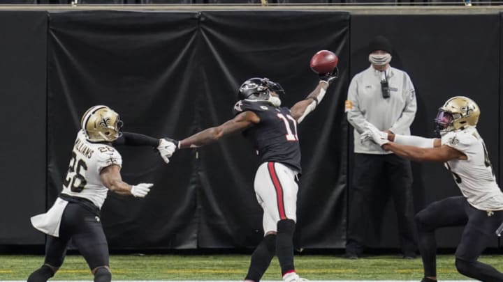 Dec 6, 2020; Atlanta, Georgia, USA; Atlanta Falcons wide receiver Julio Jones (11) is defended by New Orleans Saints cornerback P.J. Williams (26) and safety Marcus Williams (43) preventing a touchdown on a fourth down play during the second half at Mercedes-Benz Stadium. Mandatory Credit: Dale Zanine-USA TODAY Sports