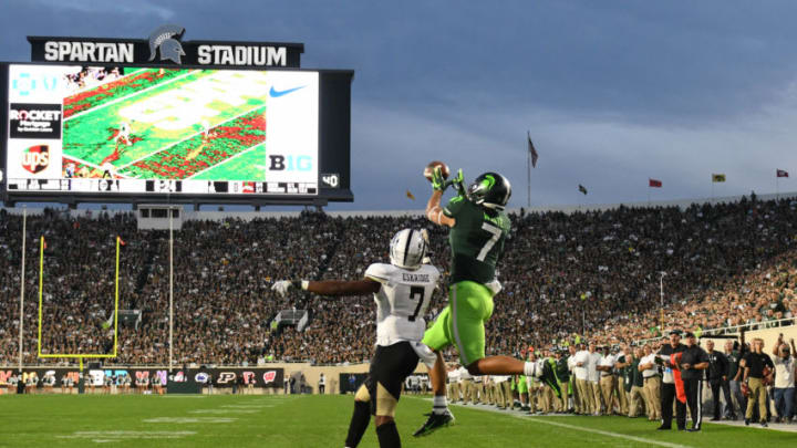 Cody White of MSU tries to snag a pass in the end zone against D'Wayne Eskridge of WMU Saturday, Sept. 7, 2019, at Spartan Stadium.Msu Vs Western Michigan