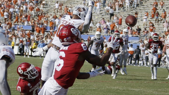 Oct 10, 2020; Dallas, TX, USA; Oklahoma's Tre Brown (6) intercepts a pass in front of Texas' Tarik Black (0) to end the Red River Showdown college football game between the Oklahoma Sooners (OU) and the Texas Longhorns (UT) at Cotton Bowl Stadium in Dallas, Saturday, Oct. 10, 2020. Oklahoma won 53-45 in four overtimes. Mandatory Credit: Bryan Terry-USA TODAY NETWORK