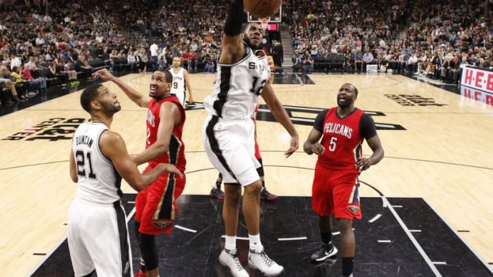 Mar 30, 2016; San Antonio, TX, USA; San Antonio Spurs power forward LaMarcus Aldridge (12) dunks the ball as New Orleans Pelicans center Kendrick Perkins (5) looks on during the second half at AT&T Center. The Spurs won 100-92. Mandatory Credit: Soobum Im-USA TODAY Sports Mar 30, 2016; San Antonio, TX, USA; San Antonio Spurs power forward LaMarcus Aldridge (12) dunks the ball as New Orleans Pelicans center Kendrick Perkins (5) looks on during the second half at AT&T Center. The Spurs won 100-92. Mandatory Credit: Soobum Im-USA TODAY Sports