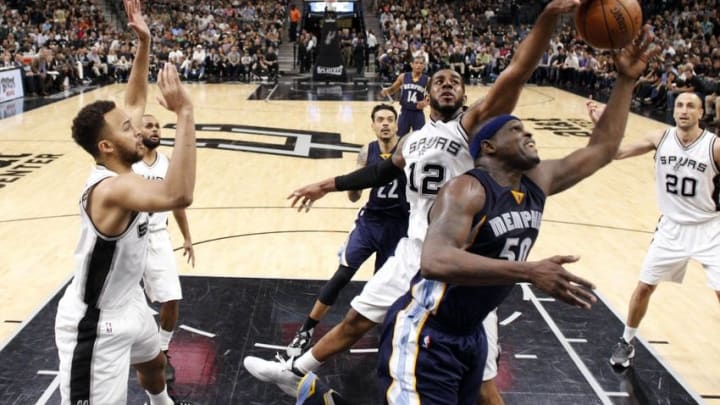 Apr 19, 2016; San Antonio, TX, USA; Memphis Grizzlies power forward Zach Randolph (50, front) has his shot blocked by San Antonio Spurs power forward LaMarcus Aldridge (12, behind) in game two of the first round of the NBA Playoffs at AT&T Center. Mandatory Credit: Soobum Im-USA TODAY Sports