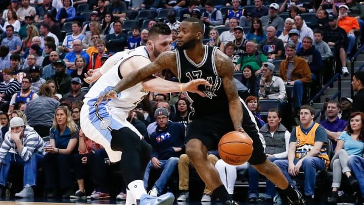 Apr 8, 2016; Denver, CO, USA; Denver Nuggets center Joffrey Lauvergne (77) defends against San Antonio Spurs guard Jonathon Simmons (17) in the second quarter at the Pepsi Center. Mandatory Credit: Isaiah J. Downing-USA TODAY Sports