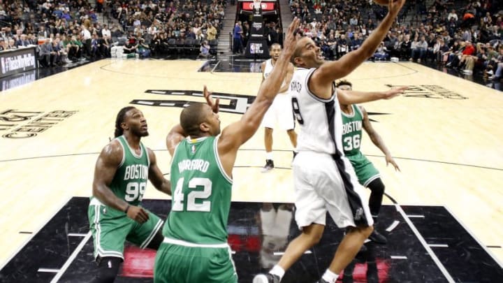 Dec 14, 2016; San Antonio, TX, USA; San Antonio Spurs point guard Tony Parker (9) shoots the ball past Boston Celtics center Al Horford (42) during the second half at AT&T Center. The Spurs won 108-101. Mandatory Credit: Soobum Im-USA TODAY Sports