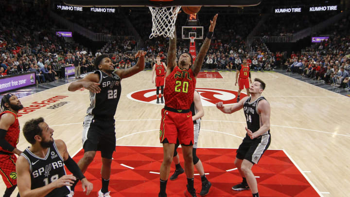 Mar 6, 2019; Atlanta, GA, USA; Atlanta Hawks forward John Collins (20) reaches for a rebound against the San Antonio Spurs in the fourth quarter at St