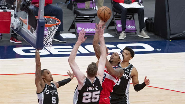 Apr 26, 2021; Washington, District of Columbia, USA; Washington Wizards guard Bradley Beal (3) shoots one rSan Antonio Spurs defenders during over tim