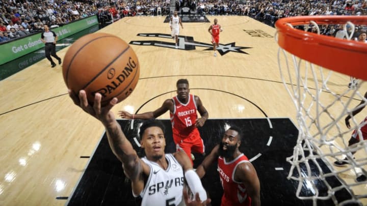 SAN ANTONIO, TX - OCTOBER 7: Dejounte Murray #5 of the San Antonio Spurs shoots the ball against the Houston Rockets during a pre-season game on October 7, 2018 at the AT&T Center in San Antonio, Texas. NOTE TO USER: User expressly acknowledges and agrees that, by downloading and or using this photograph, user is consenting to the terms and conditions of the Getty Images License Agreement. Mandatory Copyright Notice: Copyright 2018 NBAE (Photos by Mark Sobhani/NBAE via Getty Images)