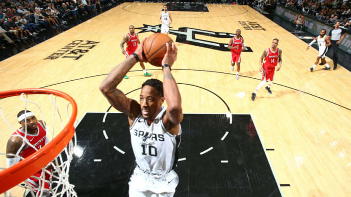 SAN ANTONIO, TX - OCTOBER 7: DeMar DeRozan #10 of the San Antonio Spurs dunks the ball against the Houston Rockets on October 7, 2018 at AT&T Center, in San Antonio, Texas. NOTE TO USER: User expressly acknowledges and agrees that, by downloading and/or using this Photograph, user is consenting to the terms and conditions of the Getty Images License Agreement. Mandatory Copyright Notice: Copyright 2018 NBAE (Photo by Nathaniel S. Butler/NBAE via Getty Images)