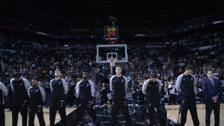 The San Antonio Spurs stand for the National Anthem (Photo by Mark Sobhani/NBAE via Getty Images)