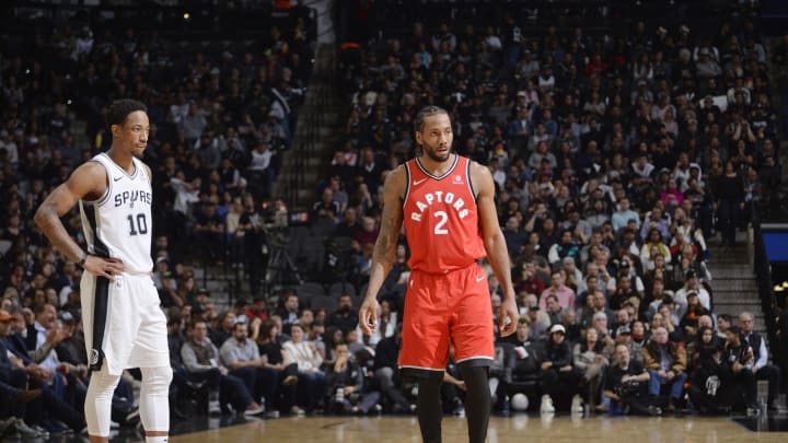 SAN ANTONIO, TX – JANUARY 3: DeMar DeRozan #10 of the San Antonio Spurs and Kawhi Leonard #2 of the Toronto Raptors look on during the game on January 3, 2019 (Photos by Mark Sobhani/NBAE via Getty Images)