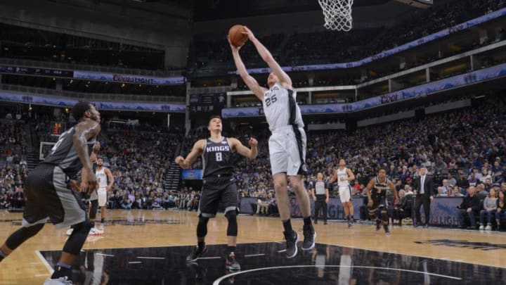 SACRAMENTO, CA - FEBRUARY 4: Jakob Poeltl #25 of the San Antonio Spurs rebounds against the Sacramento Kings on February 4, 2019 at Golden 1 Center in Sacramento, California. NOTE TO USER: User expressly acknowledges and agrees that, by downloading and or using this photograph, User is consenting to the terms and conditions of the Getty Images Agreement. Mandatory Copyright Notice: Copyright 2019 NBAE (Photo by Rocky Widner/NBAE via Getty Images)