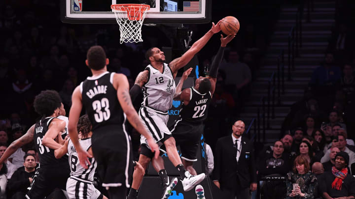 NEW YORK, NY – FEBRUARY 25: LaMarcus Aldridge #12 of the San Antonio Spurs blocks a shot made by Caris LeVert #22 of the Brooklyn Nets during the game at Barclays Center. (Photo by Matteo Marchi/Getty Images)