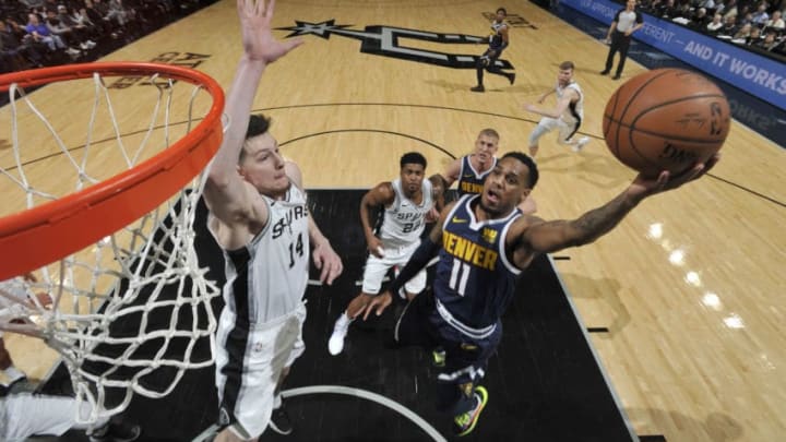 SAN ANTONIO, TX - MARCH 4: Drew Eubanks #14 of the San Antonio Spurs blocks the shot by Monte Morris #11 of the Denver Nuggets on March 4, 2019 at the AT&T Center in San Antonio, Texas. NOTE TO USER: User expressly acknowledges and agrees that, by downloading and or using this photograph, user is consenting to the terms and conditions of the Getty Images License Agreement. Mandatory Copyright Notice: Copyright 2019 NBAE (Photos by Mark Sobhani/NBAE via Getty Images)