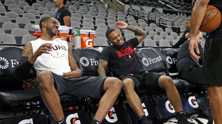 SAN ANTONIO, TX – MARCH 16: LaMarcus Aldridge #12 of the San Antonio Spurs greets former teammate Damian Lillard #0 of the Portland Trail Blazers at AT&T Center (Photo by Ronald Cortes/Getty Images)