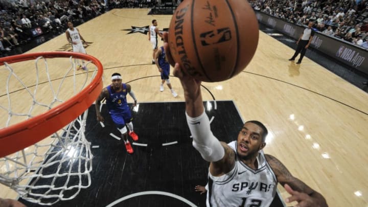 SAN ANTONIO, TX - APRIL 20: LaMarcus Aldridge #12 of the San Antonio Spurs shoots the ball against the Denver Nuggets during Game Four of Round One of the 2019 NBA Playoffs on April 20, 2019 at the AT&T Center in San Antonio, Texas. NOTE TO USER: User expressly acknowledges and agrees that, by downloading and or using this photograph, user is consenting to the terms and conditions of the Getty Images License Agreement. Mandatory Copyright Notice: Copyright 2019 NBAE (Photos by Mark Sobhani/NBAE via Getty Images)