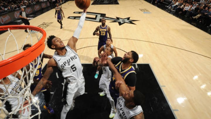 SAN ANTONIO, TX - NOVEMBER 3: Dejounte Murray #5 of the San Antonio Spurs grabs a rebound against the Los Angeles Lakers on November 3, 2019 at the Toyota Center in San Antonio, Texas. NOTE TO USER: User expressly acknowledges and agrees that, by downloading and or using this photograph, User is consenting to the terms and conditions of the Getty Images License Agreement. Mandatory Copyright Notice: Copyright 2019 NBAE (Photo by Bill Baptist/NBAE via Getty Images)
