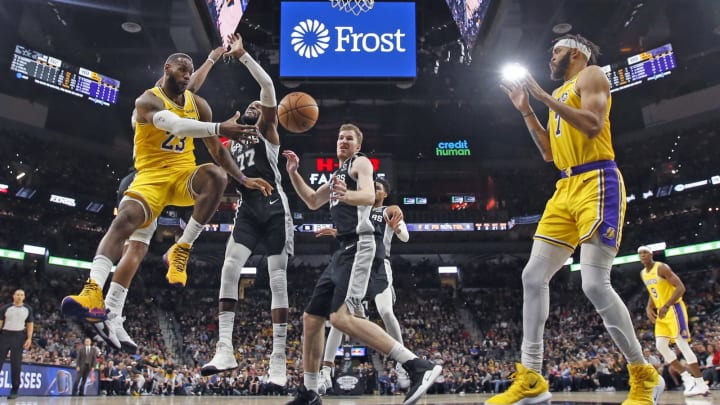 SAN ANTONIO, TX – NOVEMBER 25: LeBron James #23 of the Los Angeles Lakers drives against the San Antonio Spurs as he passes off to teammate JaVale McGee #7 in the second half at AT&T Center (Photo by Ronald Cortes/Getty Images)