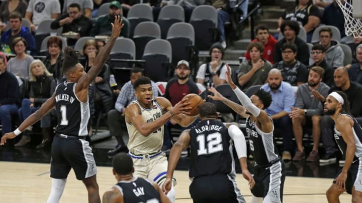 SAN ANTONIO, TX - JANUARY 6: Giannis Antetokounmpo #34 of the Milwaukee Bucks draws the attention of all the San Antonio Spurs during first-half action at AT&T Center (Photo by Ronald Cortes/Getty Images)