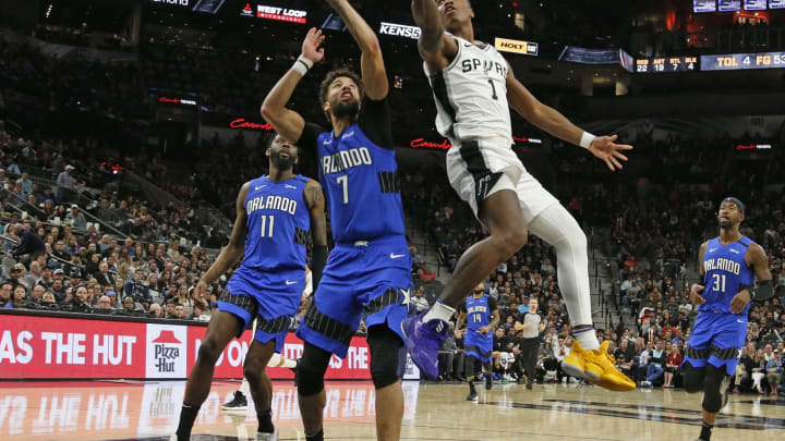 SAN ANTONIO, TX – FEBRUARY 29: Lonnie Walker #1 of the San Antonio Spurs drives on Michael Carter-Williams #7 of the Orlando Magic during s second half action at AT&T Center (Photo by Ronald Cortes/Getty Images)