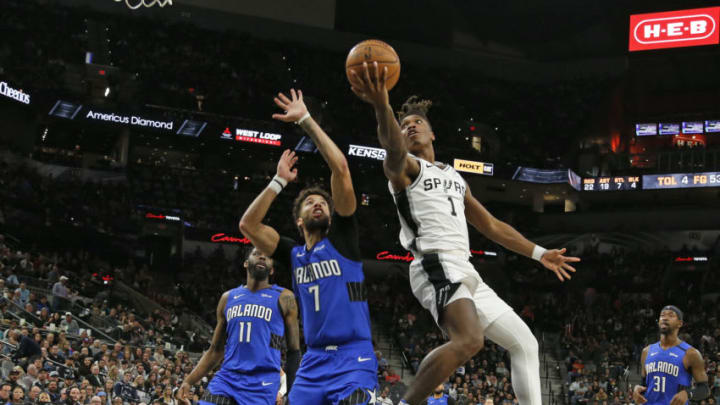 SAN ANTONIO, TX - FEBRUARY 29: Lonnie Walker #1 of the San Antonio Spurs drives on Michael Carter-Williams #7 of the Orlando Magic during s second half action at AT&T Center (Photo by Ronald Cortes/Getty Images)