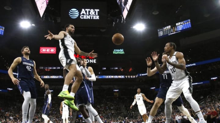 SAN ANTONIO, TX - MARCH 10: Trey Lyles #41 of the San Antonio Spurs passes off to DeMar DeRozan #10 during first half action at AT&T Center on March 10, 2020 in San Antonio, Texas. San Antonio Spurs defeated the Dallas Mavericks 119-109. NOTE TO USER: User expressly acknowledges and agrees that , by downloading and or using this photograph, User is consenting to the terms and conditions of the Getty Images License Agreement. (Photo by Ronald Cortes/Getty Images)