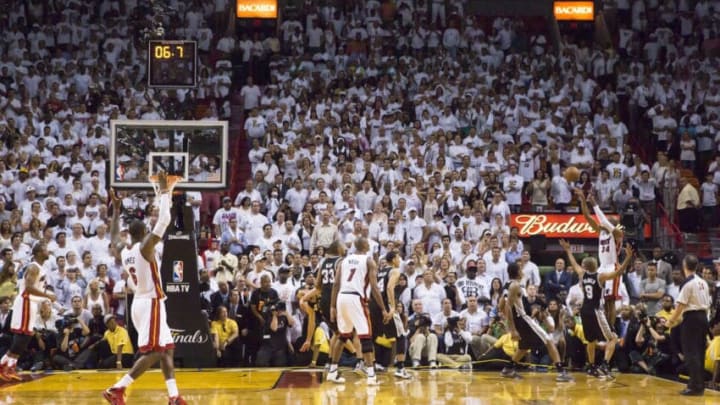 MIAMI, FL - JUNE 18: Ray Allen #34 of the Miami Heat hits a three-point shot to tie the score and send the San Antonio Spurs into overtime in Game Six of the 2013 NBA Finals on June 18, 2013 at American Airlines Arena in Miami, Florida. NOTE TO USER: User expressly acknowledges and agrees that, by downloading and or using this photograph, User is consenting to the terms and conditions of the Getty Images License Agreement. Mandatory Copyright Notice: Copyright 2013 NBAE (Photo by Nathaniel S. Butler/NBAE via Getty Images)