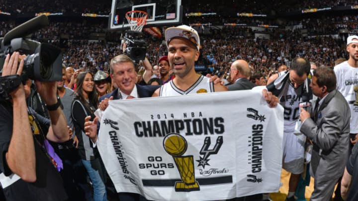 SAN ANTONIO, TX - JUNE 15: Tony Parker #9 of the San Antonio Spurs celebrates winning the 2014 NBA Championship after Game Five of the 2014 NBA Finals against the Miami Heat on June 15, 2014 at AT&T Center in San Antonio, Texas. NOTE TO USER: User expressly acknowledges and agrees that, by downloading and or using this photograph, User is consenting to the terms and conditions of the Getty Images License Agreement. Mandatory Copyright Notice: Copyright 2014 NBAE (Photo by Jesse D. Garrabrant/NBAE via Getty Images)