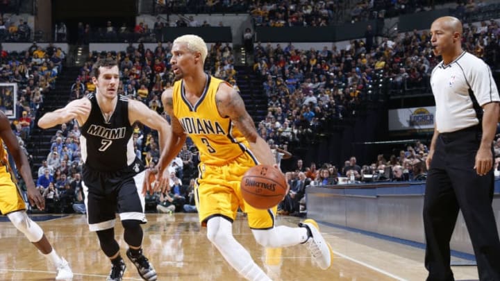 INDIANAPOLIS, IN - DECEMBER 11: George Hill #3 of the Indiana Pacers handles the ball against Goran Dragic #7 of the Miami Heat in the second half of the game at Bankers Life Fieldhouse on December 11, 2015 in Indianapolis, Indiana. The Pacers defeated the Heat 96-83. NOTE TO USER: User expressly acknowledges and agrees that, by downloading and or using the photograph, User is consenting to the terms and conditions of the Getty Images License Agreement. (Photo by Joe Robbins/Getty Images)