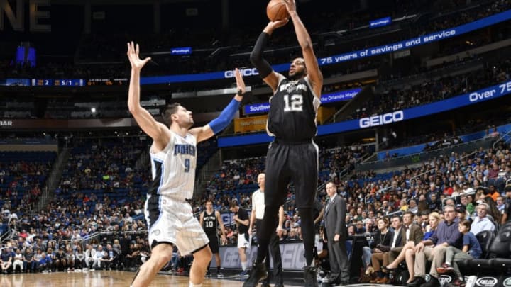 ORLANDO, FL - FEBRUARY 15: LaMarcus Aldridge #12 of the San Antonio Spurs shoots the ball against Nikola Vucevic #9 of the Orlando Magic (Photo by Fernando Medina/NBAE via Getty Images)