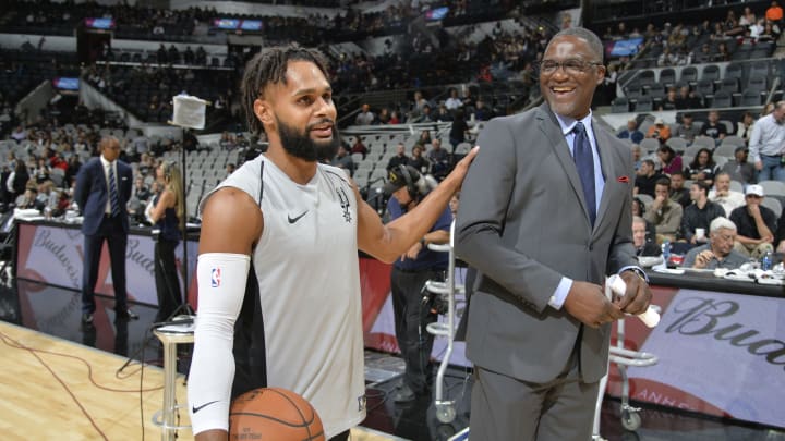 SAN ANTONIO, TX – NOVEMBER 20: Patty Mills #8 of the San Antonio Spurs speaks with Dominique Wilkins before the game against Atlanta Hawks (Photos by Mark Sobhani/NBAE via Getty Images)