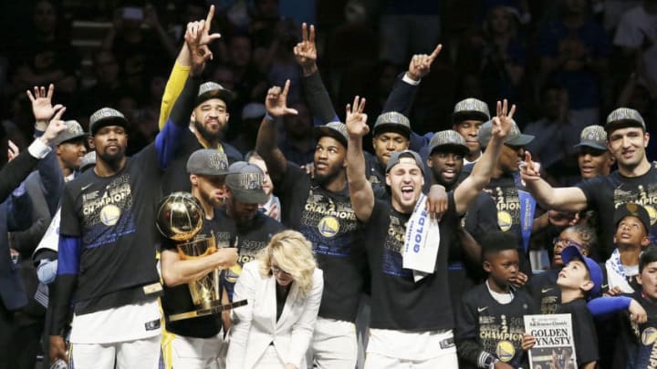 CLEVELAND, CA - JUN 8: the Golden State Warriors pose with the Larry O'Brien Championship trophy after defeating the Cleveland Cavaliers in Game Four of the 2018 NBA Finals won 108-85 by the Golden State Warriors over the Cleveland Cavaliers at the Quicken Loans Arena on June 6, 2018 in Cleveland, Ohio. NOTE TO USER: User expressly acknowledges and agrees that, by downloading and or using this photograph, User is consenting to the terms and conditions of the Getty Images License Agreement. Mandatory Copyright Notice: Copyright 2018 NBAE (Photo by Chris Elise/NBAE via Getty Images)