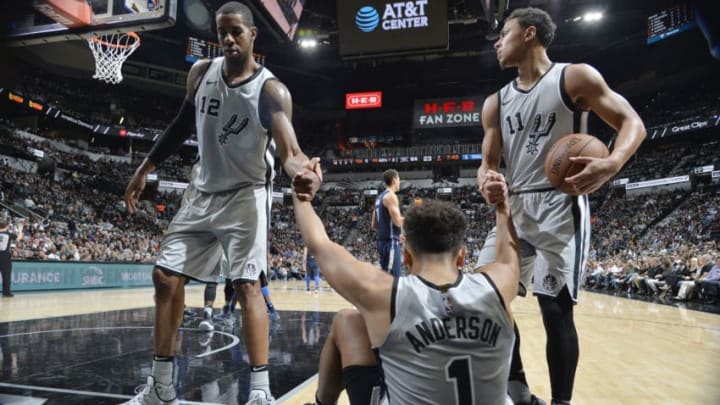 SAN ANTONIO, TX - NOVEMBER 27: Kyle Anderson #1 of the San Antonio Spurs is helped to his feet by his team as they play against the Dallas Mavericks on November 27, 2017 at the AT&T Center in San Antonio, Texas. NOTE TO USER: User expressly acknowledges and agrees that, by downloading and or using this photograph, user is consenting to the terms and conditions of the Getty Images License Agreement. Mandatory Copyright Notice: Copyright 2017 NBAE (Photos by Mark Sobhani/NBAE via Getty Images)