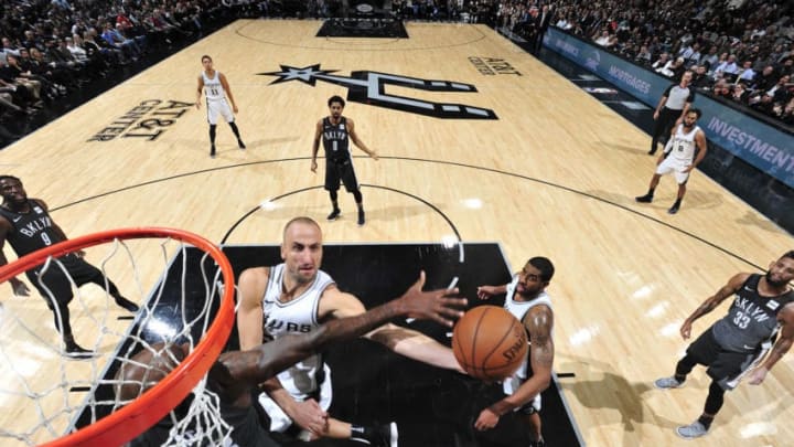 SAN ANTONIO, TX - DECEMBER 26: Manu Ginobili #20 of the San Antonio Spurs handles the ball against the Brooklyn Nets on December 26, 2017 at the AT&T Center in San Antonio, Texas. NOTE TO USER: User expressly acknowledges and agrees that, by downloading and or using this photograph, user is consenting to the terms and conditions of the Getty Images License Agreement. Mandatory Copyright Notice: Copyright 2017 NBAE (Photos by Mark Sobhani/NBAE via Getty Images)