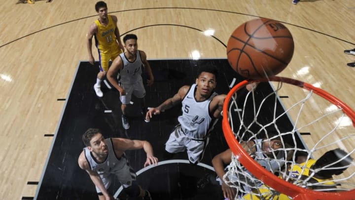 SAN ANTONIO, TX - MARCH 3: Dejounte Murray #5 of the San Antonio Spurs handles the ball against the Los Angeles Lakers on March 3, 2018 at the AT&T Center in San Antonio, Texas. NOTE TO USER: User expressly acknowledges and agrees that, by downloading and or using this photograph, user is consenting to the terms and conditions of the Getty Images License Agreement. Mandatory Copyright Notice: Copyright 2018 NBAE (Photos by Mark Sobhani/NBAE via Getty Images)
