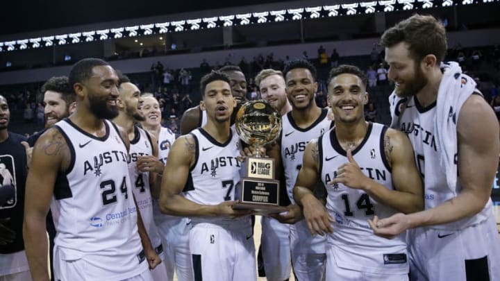 CEDAR PARK, TX - APRIL 5: Nick Johnson #14 of the Austin Spurs holding the Western Conference Champion trophy celebrates with his teammates after defeating the South Bay Lakers during the Conference Finals on April 5, 2018 at H-E-B Center at Cedar Park in Cedar Park, Texas. NOTE TO USER: User expressly acknowledges and agrees that, by downloading and or using this photograph, user is consenting to the terms and conditions of the Getty Images License Agreement. Mandatory Copyright Notice: Copyright 2018 NBAE (Photos by Chris Covatta/NBAE via Getty Images)