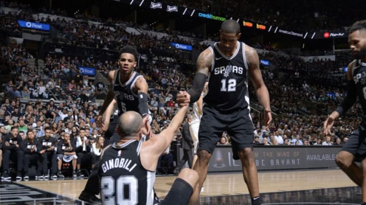 SAN ANTONIO, TX - APRIL 22: Dejounte Murray #5 and LaMarcus Aldridge #12 help up Manu Ginobili #20 of the San Antonio Spurs in Game Four of the Western Conference Quarterfinals against the Golden State Warriors during the 2018 NBA Playoffs on April 22, 2018 at the AT&T Center in San Antonio, Texas. NOTE TO USER: User expressly acknowledges and agrees that, by downloading and/or using this photograph, user is consenting to the terms and conditions of the Getty Images License Agreement. Mandatory Copyright Notice: Copyright 2018 NBAE (Photos by Mark Sobhani/NBAE via Getty Images)