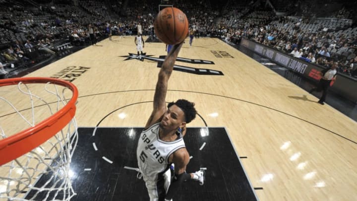 SAN ANTONIO, TX - APRIL 19: Dejounte Murray #5 of the San Antonio Spurs dunks the ball against the Golden State Warriors during Game Three of the Western Conference Quarterfinals in the 2018 NBA Playoffs on April 19, 2018 at the AT&T Center in San Antonio, Texas. NOTE TO USER: User expressly acknowledges and agrees that, by downloading and/or using this photograph, user is consenting to the terms and conditions of the Getty Images License Agreement. Mandatory Copyright Notice: Copyright 2018 NBAE (Photos by Mark Sobhani/NBAE via Getty Images)