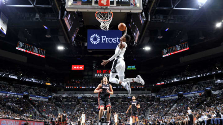 SAN ANTONIO, TX - SEPTEMBER 30: Dejounte Murray #5 of the San Antonio Spurs dunks the ball against the Miami Heat during a pre-season game on September 30, 2018 at the AT&T Center in San Antonio, Texas. NOTE TO USER: User expressly acknowledges and agrees that, by downloading and or using this photograph, user is consenting to the terms and conditions of the Getty Images License Agreement. Mandatory Copyright Notice: Copyright 2018 NBAE (Photos by Mark Sobhani/NBAE via Getty Images)