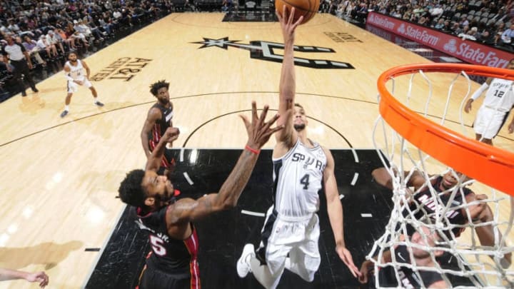 SAN ANTONIO, TX - SEPTEMBER 30: Derrick White #4 of the San Antonio Spurs shoots the ball against the Miami Heat during a pre-season game on September 30, 2018 at the AT&T Center in San Antonio, Texas. NOTE TO USER: User expressly acknowledges and agrees that, by downloading and/or using this Photograph, user is consenting to the terms and conditions of the Getty Images License Agreement. Mandatory Copyright Notice: Copyright 2018 NBAE (Photo by Bill Baptist/NBAE via Getty Images)