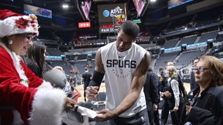SAN ANTONIO, TX - DECEMBER 21: LaMarcus Aldridge #12 of the San Antonio Spurs signs an autograph for a fan prior to the game against the Minnesota Timberwolves on December 21, 2018 at the AT&T Center in San Antonio, Texas. NOTE TO USER: User expressly acknowledges and agrees that, by downloading and or using this photograph, user is consenting to the terms and conditions of the Getty Images License Agreement. Mandatory Copyright Notice: Copyright 2018 NBAE (Photos by Mark Sobhani/NBAE via Getty Images)