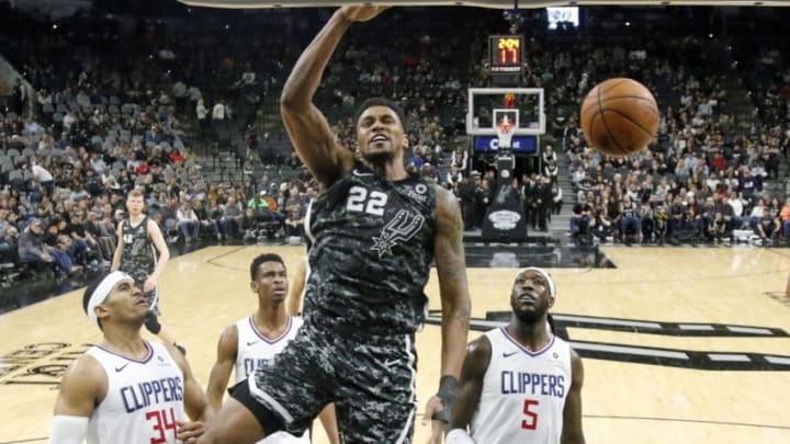 SAN ANTONIO, TX - JANUARY 20: Montrezl Harrell #5 of the Los Angeles Clippers watches Rudy Gay #22 of the San Antonio Spurs dunk at AT&T Center on January 20, 2019 in San Antonio, Texas. NOTE TO USER: User expressly acknowledges and agrees that , by downloading and or using this photograph, User is consenting to the terms and conditions of the Getty Images License Agreement. (Photo by Ronald Cortes/Getty Images)