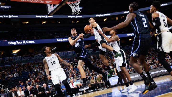 ORLANDO, FLORIDA - NOVEMBER 15: Aaron Gordon #00 of the Orlando Magic attempts to score against the defense of the San Antonio Spurs in the first quarter at Amway Center on November 15, 2019 in Orlando, Florida. NOTE TO USER: User expressly acknowledges and agrees that, by downloading and/or using this photograph, user is consenting to the terms and conditions of the Getty Images License Agreement. (Photo by Harry Aaron/Getty Images) (Photo by Harry Aaron/Getty Images)