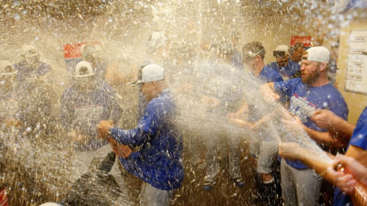 SAN FRANCISCO, CA - SEPTEMBER 29: Manager Dave Roberts #30 of the Los Angeles Dodgers is sprayed with champagne as Dodgers players celebrate after clinching a post season spot by defeating the San Francisco Giants at AT&T Park on September 29, 2018 in San Francisco, California. (Photo by Lachlan Cunningham/Getty Images)