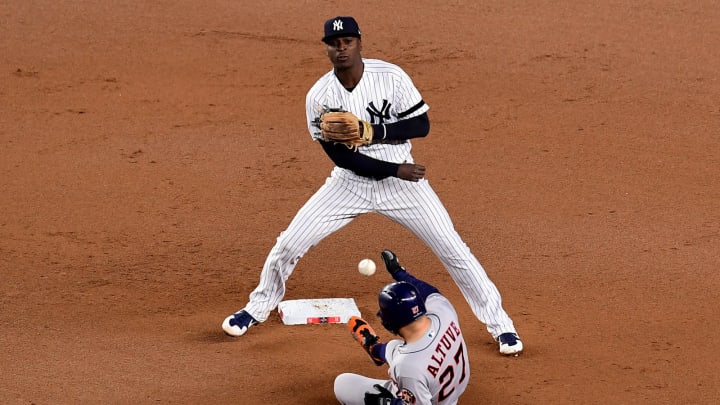 NEW YORK, NEW YORK – OCTOBER 18: Didi Gregorius #18 of the New York Yankees tags out Jose Altuve #27 of the Houston Astros during the seventh inning in Game 5 of the American League Championship Series at Yankee Stadium on October 18, 2019 in New York City. (Photo by Emilee Chinn/Getty Images)