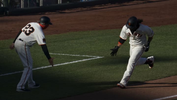 SF Giants shortstop Brandon Crawford (right) is congratulated by third base coach Ron Wotus (23) for hitting a solo home run against the San Diego Padres during the second inning of game one of a double header at Oracle Park. (Kyle Terada-USA TODAY Sports)