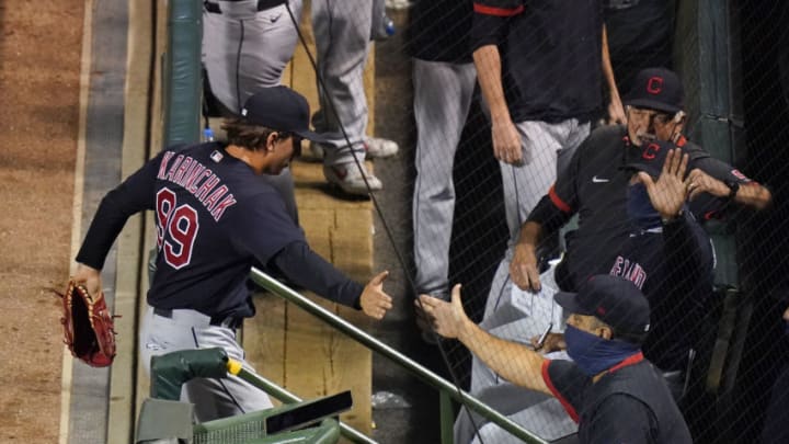 CHICAGO, ILLINOIS - SEPTEMBER 16: James Karinchak #99 of the Cleveland Indians is congratulated by teammates after pitching the seventh inning against the Chicago Cubs at Wrigley Field on September 16, 2020 in Chicago, Illinois. (Photo by Nuccio DiNuzzo/Getty Images)