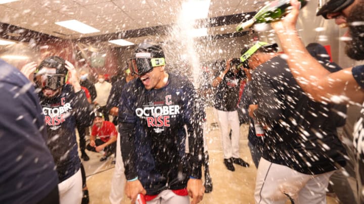 CLEVELAND, OHIO - OCTOBER 08: Members of the Cleveland Guardians celebrate in the clubhouse following their victory against the Tampa Bay Rays in game two of the Wild Card Series at Progressive Field on October 08, 2022 in Cleveland, Ohio. (Photo by Patrick Smith/Getty Images)