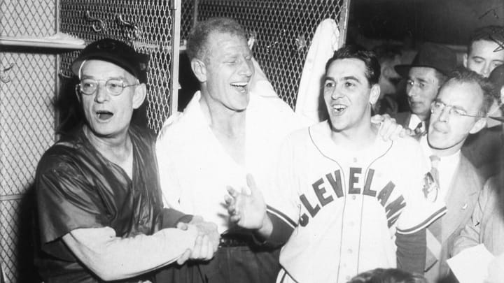 BOSTON – OCTOBER 11, 1948. The Cleveland Indians celebrate their World Series win over the Braves in Boston on October 11, 1948. (L-R) are coach Bill McKechnie, owner Bill Veeck, and manager Lou Boudreau (Photo by Mark Rucker/Transcendental Graphics, Getty Images)
